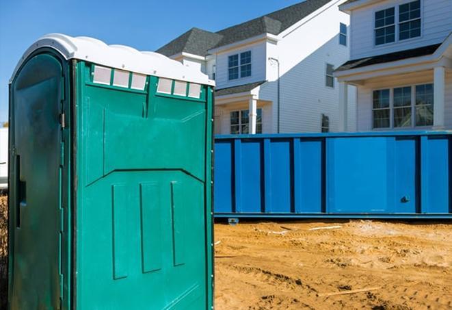 portable toilets on a busy work site, providing necessary facilities